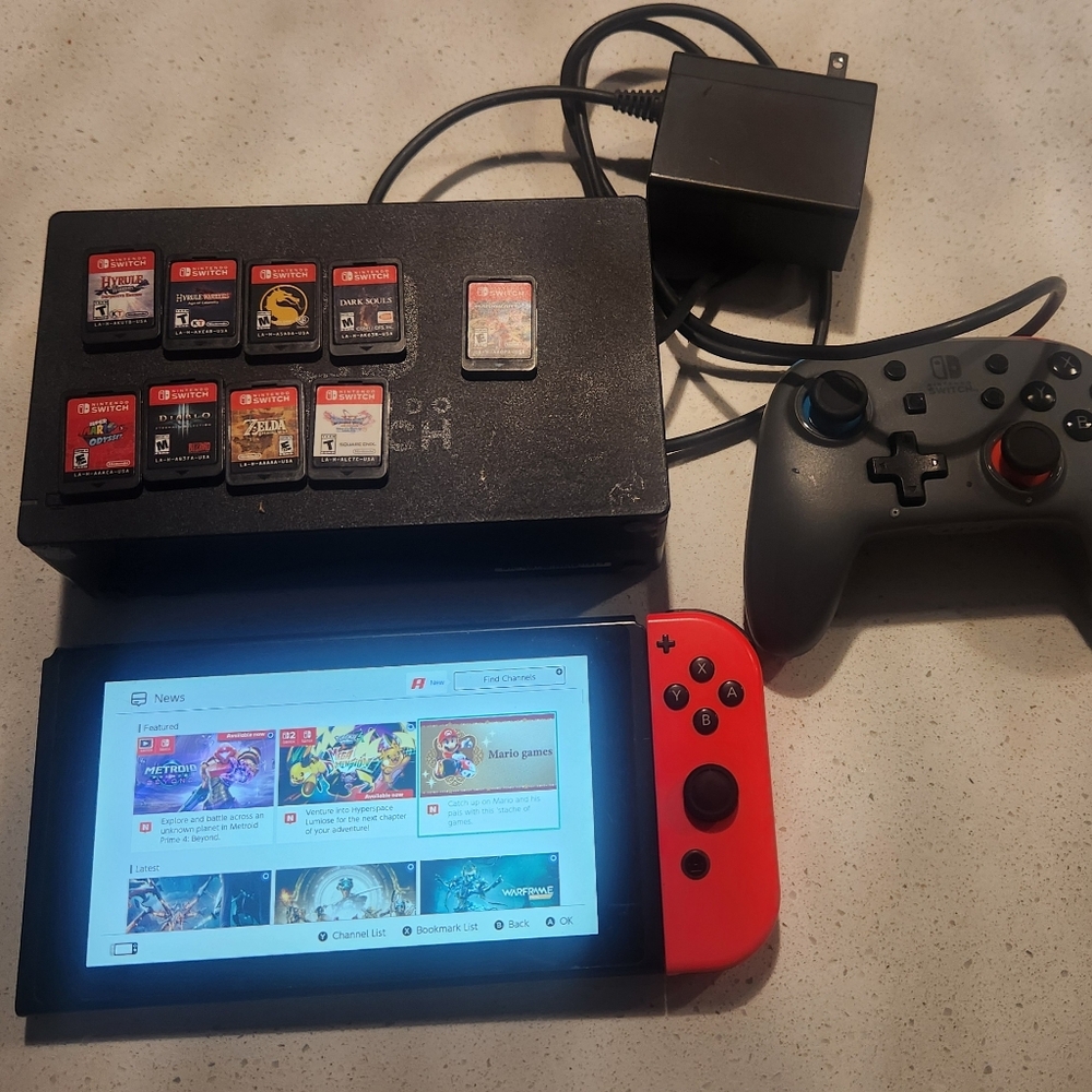 Nintendo Switch with Red Joy-Con and Pro Controller
